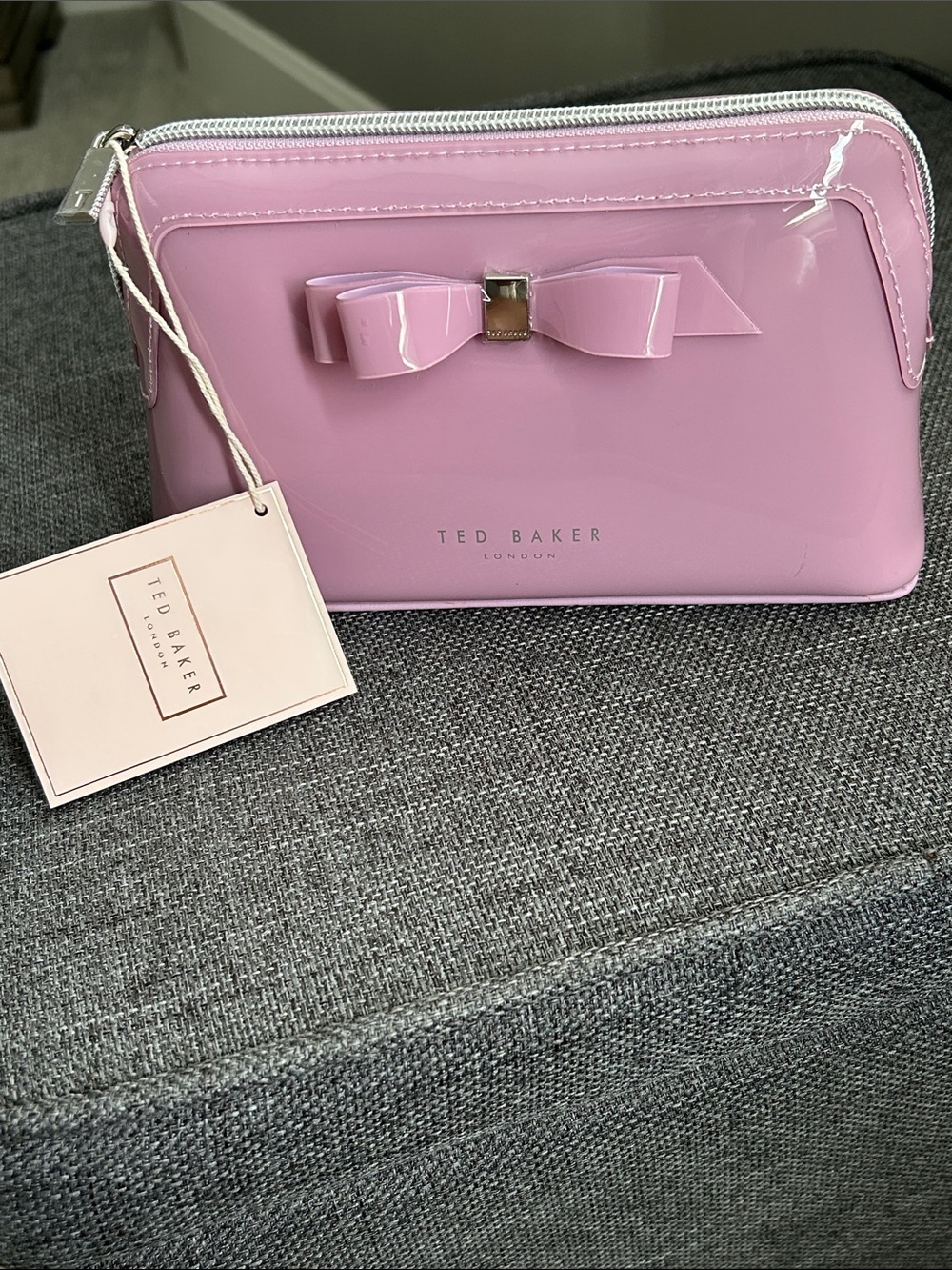 Ted Baker Lavender Patent Bow Zip Cosmetic bag